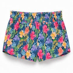 A pair of women's swim shorts featuring a vibrant tropical floral and leaf print on a dark blue background, with pink, orange, yellow, and purple flowers.