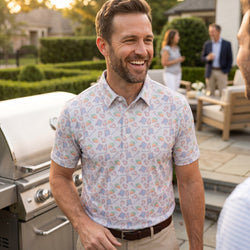 Person wearing a lacrosse patterned polo shirt at a cook out.