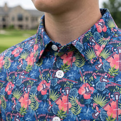Close up of a tropical themed polo shirt with lacrosse design.