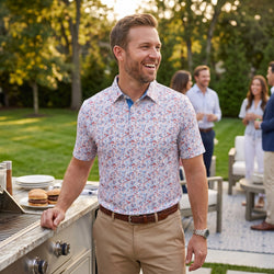 Man wearing a patriotic themed polo shirt with lacrosse patterned design at a cook out.