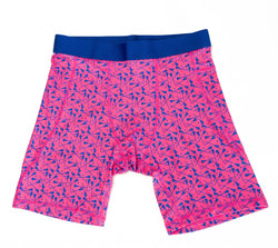 Flat lay of pink lacrosse compression shorts with lacrosse sticks pattern design