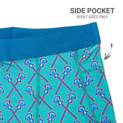Teal athletic shorts with lacrosse stick pattern and side pocket label on a white background