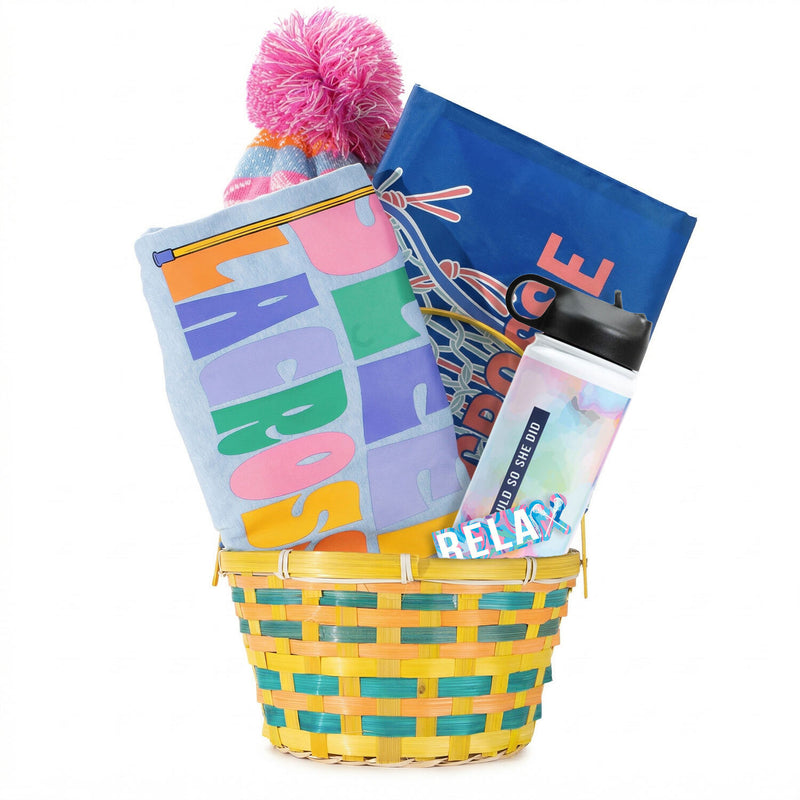 Colorful gift basket with a pom-pom hat, tee, and water bottle on a white background