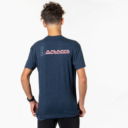 Person wearing a blue t-shirt with text on the back against a white background