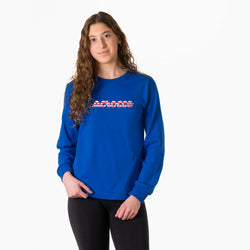 Person wearing a royal blue long sleeve tee with a patriotic lacrosse script design