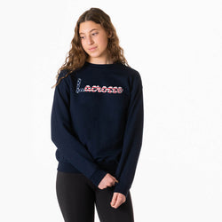 Person wearing a navy blue sweatshirt with text on a white background