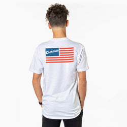 Person wearing a white t-shirt with a red, white, and blue design on the back against a white background