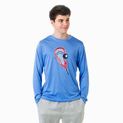 Person wearing a blue long-sleeve shirt with a lacrosse stick graphic design on a white background