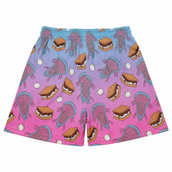 A pair of shorts featuring a colorful graphic print of pink and blue lacrosse heads and smores on a blue-to-pink gradient background, with lacrosse balls.