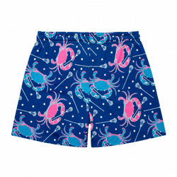 Blue swim trunks with a pattern of pink and blue crabs, white lacrosse balls, and white lacrosse sticks on a plain white background.