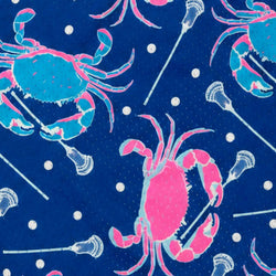A repeating pattern featuring bright pink and teal crabs holding white lacrosse sticks on a deep blue background with small white dots.