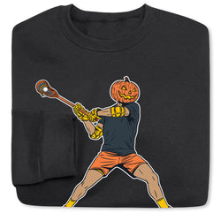 A folded black crewneck sweatshirt featuring a graphic print of a person in a Halloween pumpkin-head costume swinging a lacrosse stick, set against a plain white background.