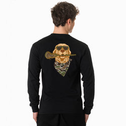 A man viewed from the back wearing a black long-sleeve shirt with a large graphic of a golden retriever wearing sunglasses and a camouflage bandana, holding a lacrosse stick.