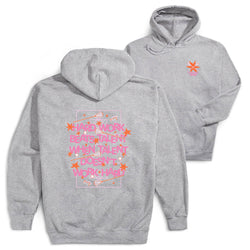 Two heather gray hoodies shown on a white background, with the back view in front and the front view behind. The back hoodie features a large pink and orange graphic with text and stars, while the front hoodie has a smaller matching star graphic on the left chest.
