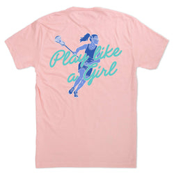 A light pink short-sleeve t-shirt shown from the back, featuring a graphic of a lacrosse player in blue and teal text that reads 'Play like a Girl'.