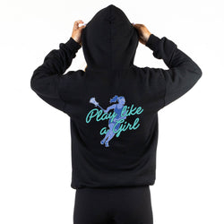 A person shown from the back wearing a black hoodie with a graphic on the back. The graphic features a blue lacrosse player illustration and the text 'Play like a Girl' in teal script.
