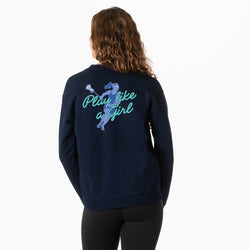A woman viewed from behind wearing a navy blue sweatshirt with a graphic on the back. The graphic features a blue of lacrosse player and the text 'Play like a girl' in light blue and teal.