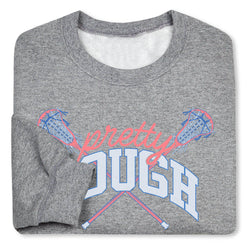 A folded heather gray crewneck sweatshirt featuring a graphic print of crossed lacrosse sticks and the words 'pretty TOUGH' in pink and white.