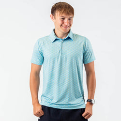 Boy wearing lightblue pickleball themed polo shirt
