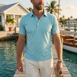 Man wearing pickleball themed polo shirt on a dock