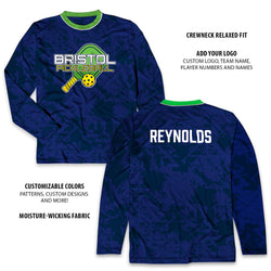 Blue long-sleeve custom tee with 'Bristol Pickleball' logo and 'REYNOLDS' text on a white background.