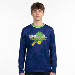 Person wearing a blue long-sleeve shirt with 'Bristol Pickleball' logo on a white background
