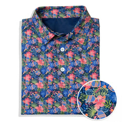 Folded polo shirt with colorful floral and pickleball pattern on a white background