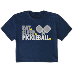 Navy blue t-shirt with 'Eat Sleep Pickleball' text and pickleball racket and ball graphics on a white background