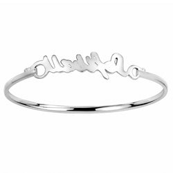 A polished silver bangle bracelet featuring a custom script nameplate across the front, displayed on a clean white background.