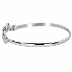 A polished silver bangle bracelet with a decorative script clasp, shown on a plain white background.