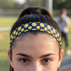 Person wearing a headband with softball pattern on a sports field