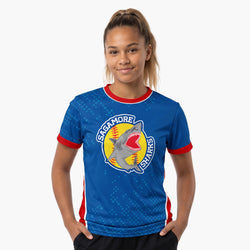 Person wearing a blue sports tee with a softball shark logo on a white background