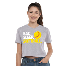 Woman wearing a gray t-shirt with 'Eat. Sleep. Softball.' text and a softball graphic on a white background