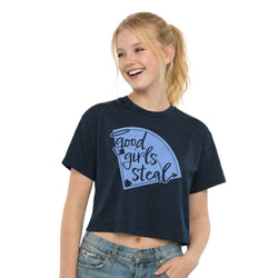 Young girl wearing a navy blue t-shirt with a softball graphic design on a white background