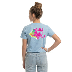Person wearing a light blue t-shirt with 'Girls with Goals' graphic on the back.