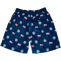 Navy swim shorts with soccer ball and American flag pattern on a white background