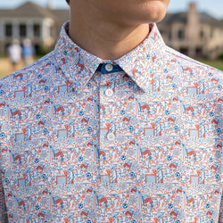 Close up of a patriotic themed polo shirt with soccer patterned design.