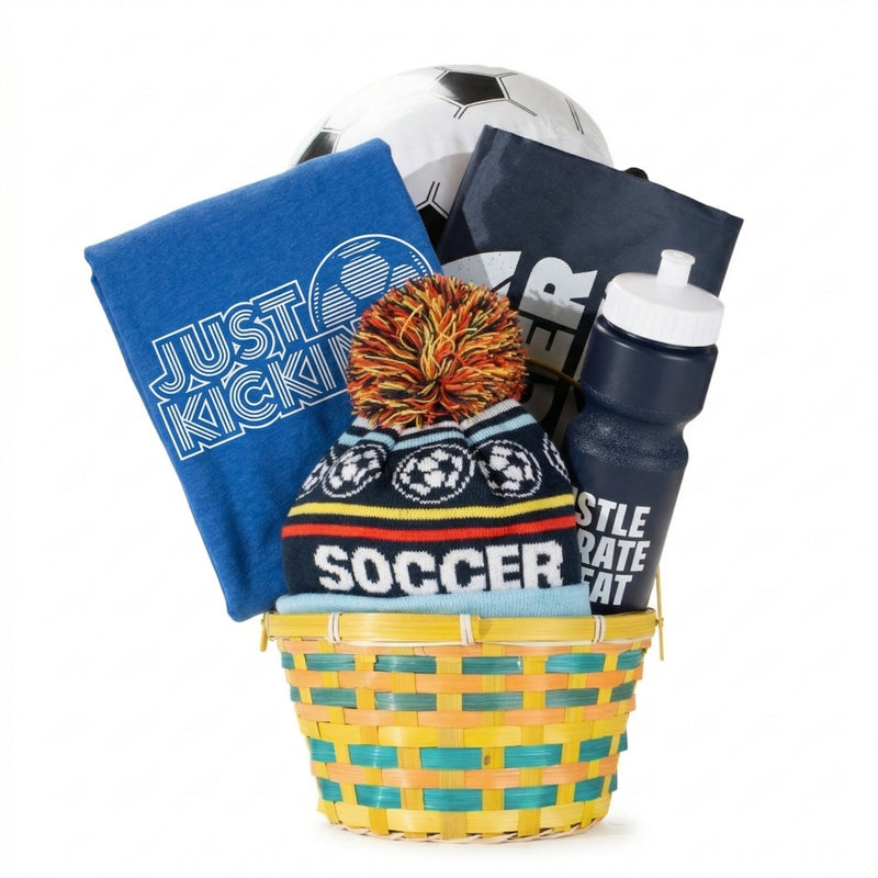 Basket with soccer-themed items including a ball, tee, beanie, and water bottle on a white background