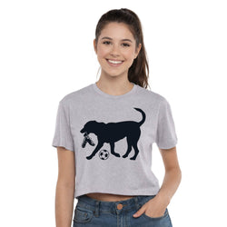 Woman wearing a gray t-shirt with a black dog soccer graphic design on a white background