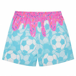 Light blue and white soccer ball patterned shorts with a bright pink dripping frosting and multicolor sprinkle design on the waistband, shown against a plain white background.