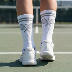 White socks with racket design on a tennis court