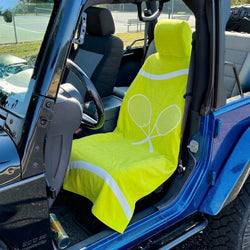Yellow seat cover with tennis racket design on a car seat