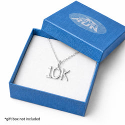 A silver 10K letter necklace displayed inside an open blue gift box with a white insert. The necklace pendant spells out '10K' in cursive.