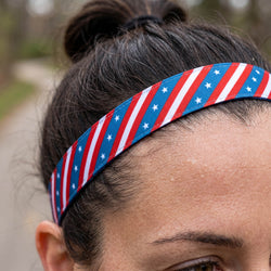 Person wearing a headband with red, white, and blue stripes and stars.