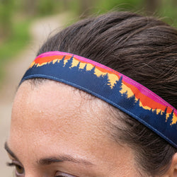 Person wearing a headband with a nature-themed design outdoors