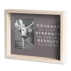 Framed picture of a runner with motivational quote on a white background