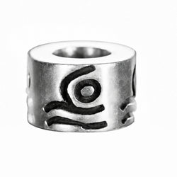A sterling silver cylindrical bead with a textured, engraved abstract design on a plain white background.