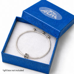 A silver-toned bangle bracelet with a small square charm, displayed inside an open textured blue gift box with a white insert. The box lid has a translucent oval logo reading 'Gone For a Run'.