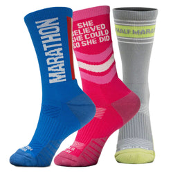 Three pairs of socks with motivational text on a white background