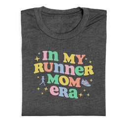 Dark gray t-shirt with colorful text 'In my runner mom era' on a white background